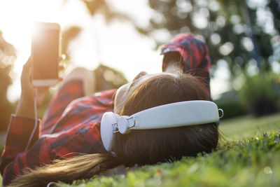 Midsection of woman using mobile phone