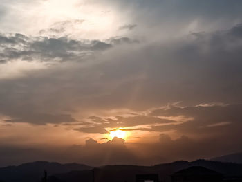 Low angle view of silhouette mountain against sky during sunset