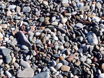 High angle view of pebbles at beach