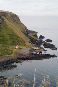 Scenic view of sea and landscape against sky