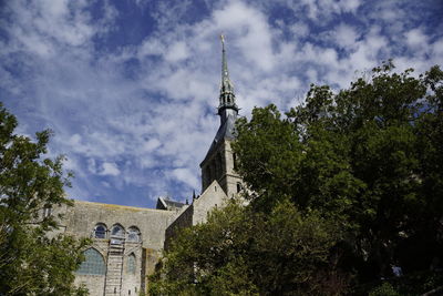 Low angle view of bell tower against sky