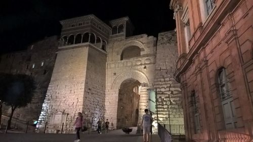 Low angle view of historical building at night