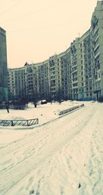 Panoramic view of city against clear sky during winter
