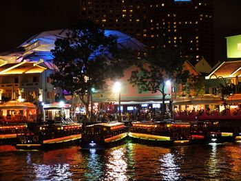Illuminated buildings in city at night