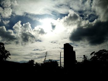 Low angle view of building against cloudy sky