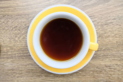 Directly above shot of coffee cup on table