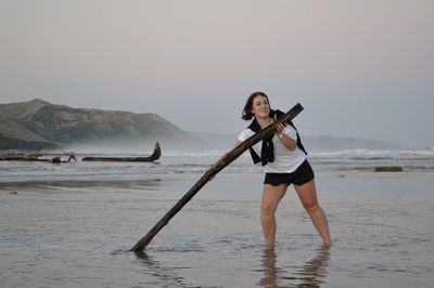 Woman standing on beach