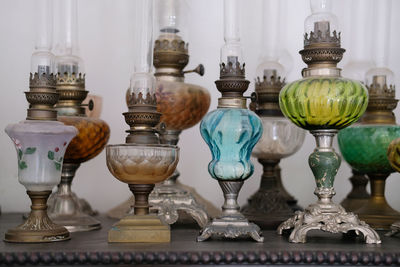 Close-up of wine glasses on table