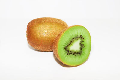 Kiwiripe whole kiwi fruit and half kiwi fruit isolated on white background