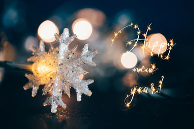 Close-up of illuminated christmas lights during winter