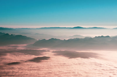 Scenic view of mountains against sky during sunset