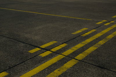 High angle view of yellow markings on road