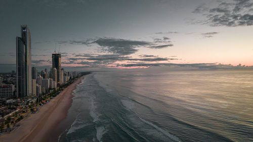 Scenic view of beach against sky during sunset