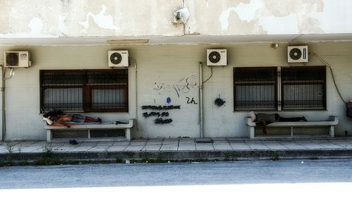 Man on window of building