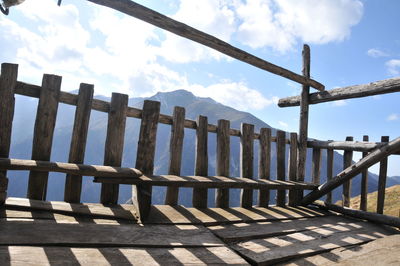 Row of railing against sky