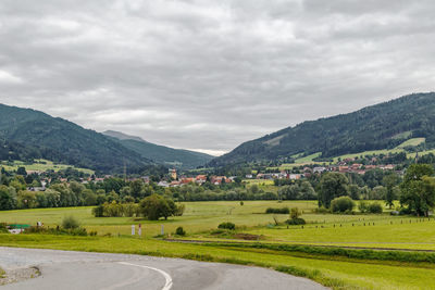 Scenic view of landscape and mountains against sky