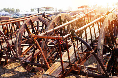 Close-up of rusty wheel on field