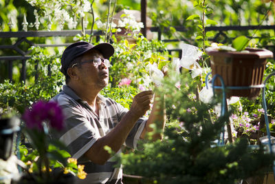 View of woman in greenhouse