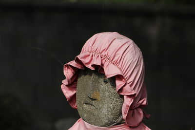 Close-up of woman holding umbrella