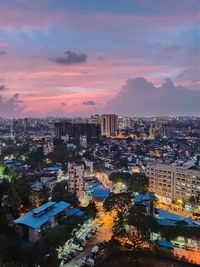 High angle view of illuminated buildings against sky during sunset