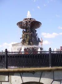 Statue fountain against sky