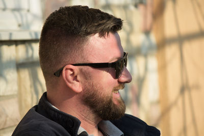 Smiling bearded man wearing sunglasses