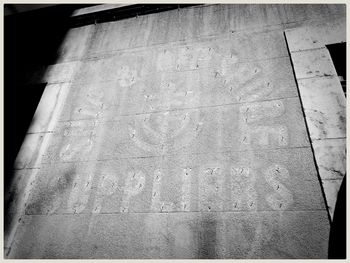 High angle view of text on footpath