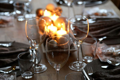 Close-up of wine glasses on table