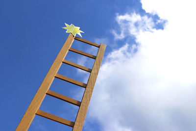 Low angle view of traditional windmill against sky