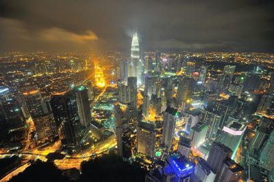 Aerial view of illuminated city at night