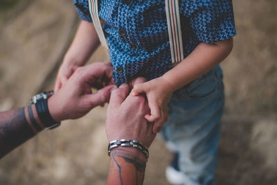 Close-up of couple holding hands