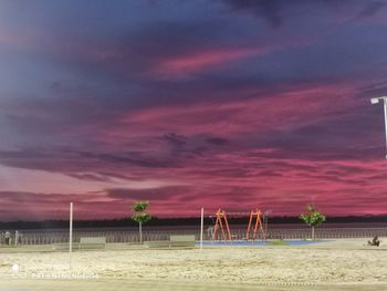 Scenic view of beach against sky during sunset