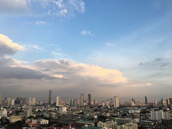 Aerial view of modern buildings in city against sky