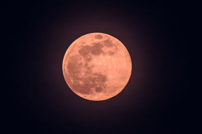 Low angle view of moon against sky at night