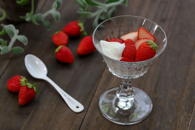 High angle view of strawberries in glass on table