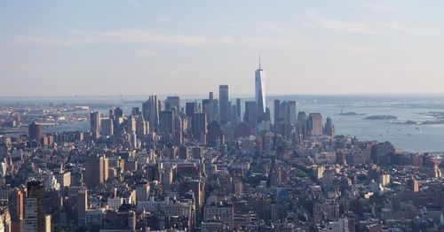 Aerial view of city buildings against sky