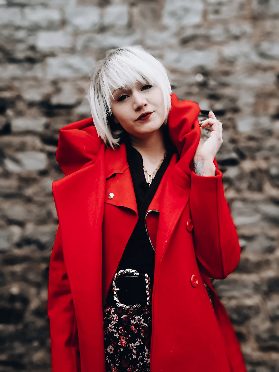 red, one person, clothing, women, adult, coat, outerwear, young adult, front view, portrait, blond hair, standing, jacket, fashion, waist up, trench coat, winter, hairstyle, looking at camera, female, lifestyles, warm clothing, day, looking, nature, outdoors, leisure activity, costume, focus on foreground, emotion, long hair, person