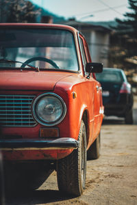 Vintage car parked on road in city