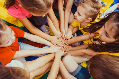 High angle view of people with hands