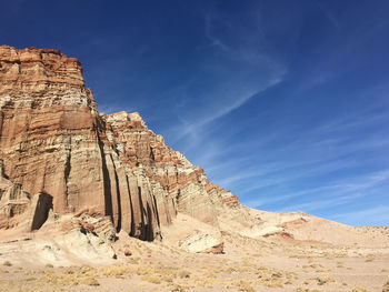 Rock formations on landscape against sky