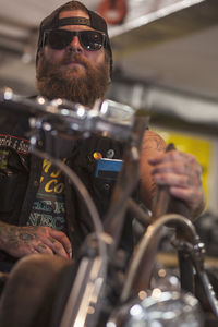 A young man on a motorcycle.