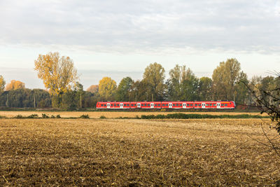 Train on field against sky