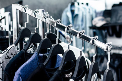 Close-up of shoes hanging on rack