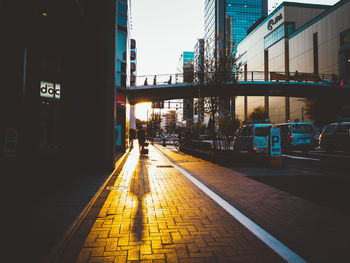 City street and buildings against sky