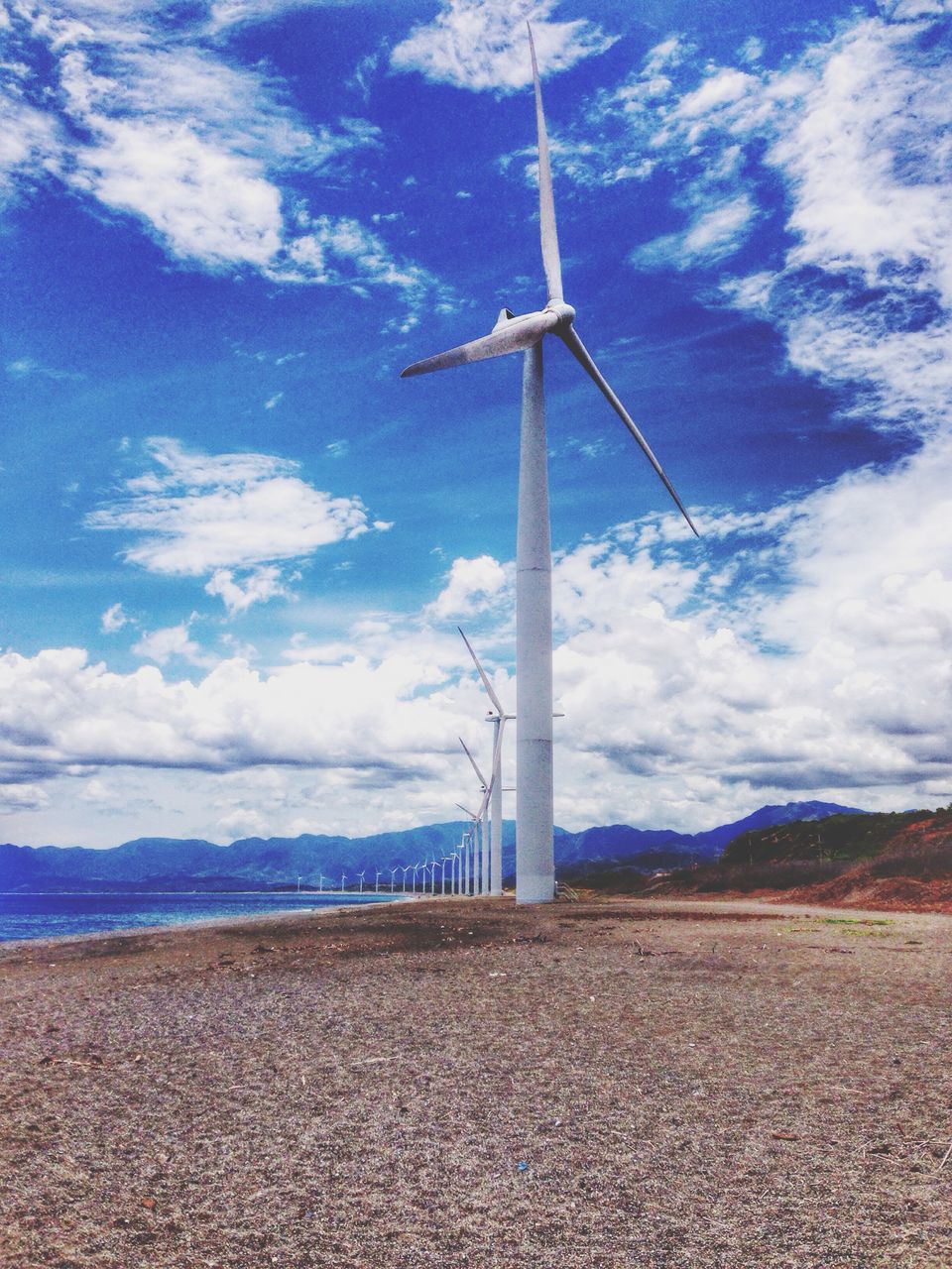 wind turbine, wind power, alternative energy, windmill, environmental conservation, sky, fuel and power generation, renewable energy, landscape, cloud - sky, tranquil scene, tranquility, cloud, rural scene, field, technology, scenics, nature, cloudy, day