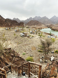 Scenic view of land and mountains against sky