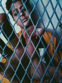 Portrait of chainlink fence in cage