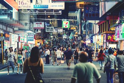 People walking on road in city