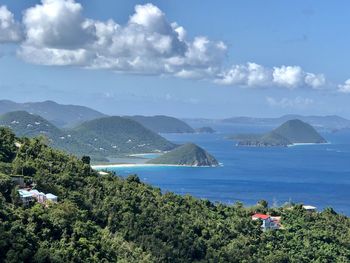 High angle view of sea and mountains against sky