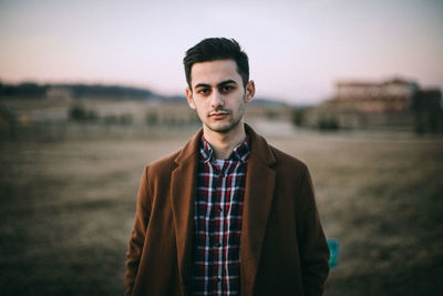 Portrait of young man standing outdoors